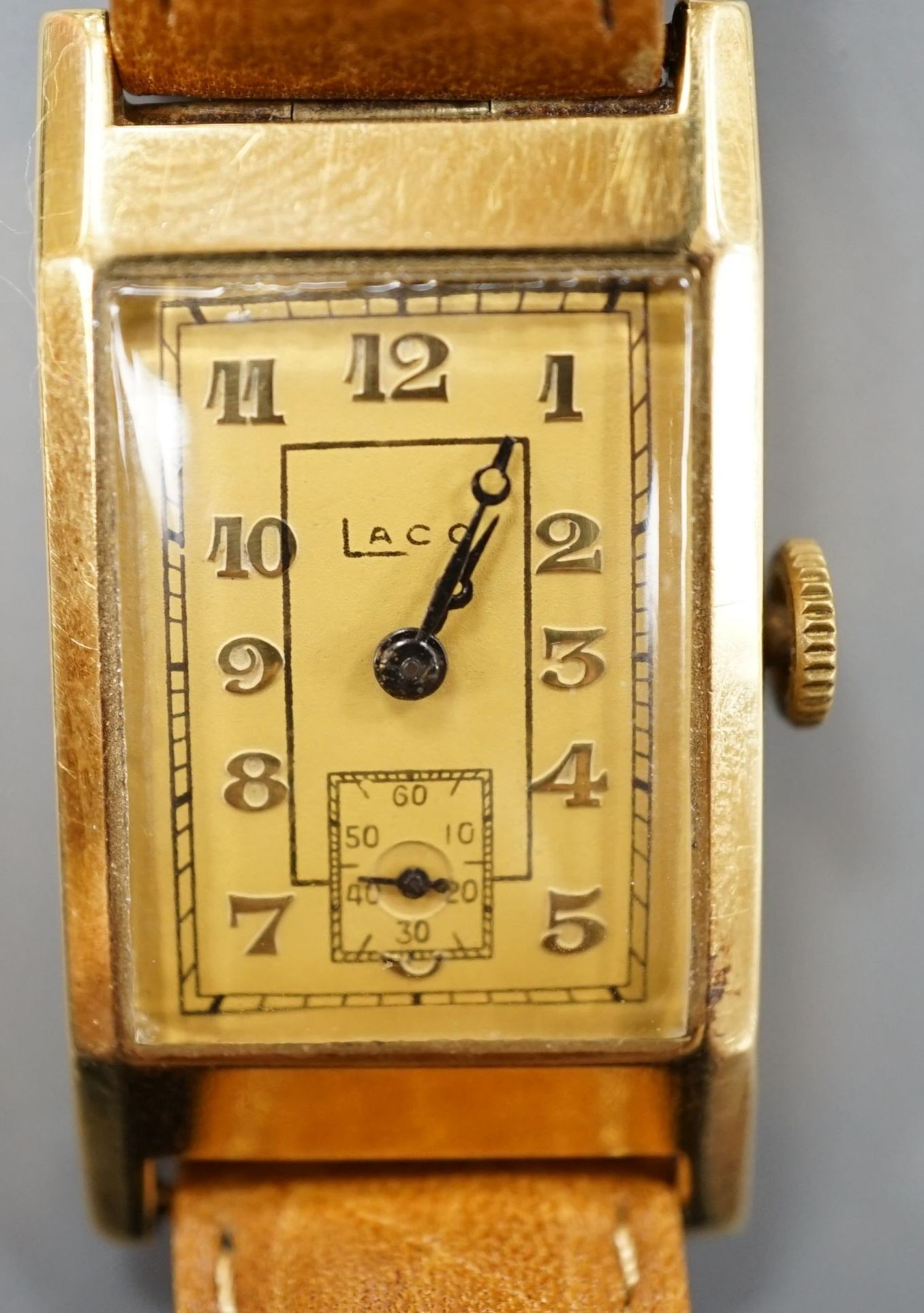 A gentleman's yellow metal Laco manual wind wrist watch, on later associated leather strap.